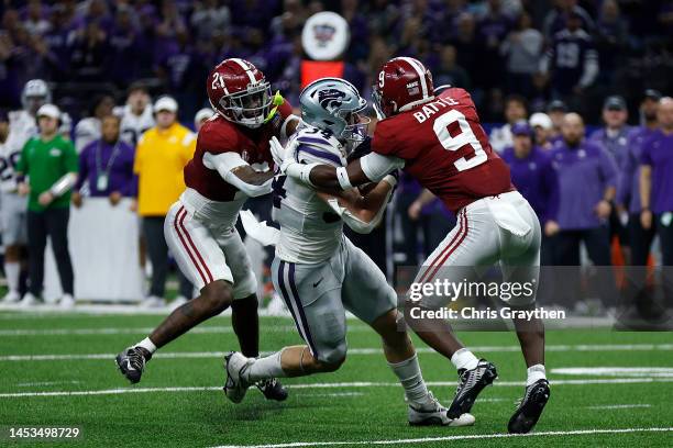 Ben Sinnott of the Kansas State Wildcats is tackled by Jordan Battle of the Alabama Crimson Tide during the Allstate Sugar Bowl at Caesars Superdome...