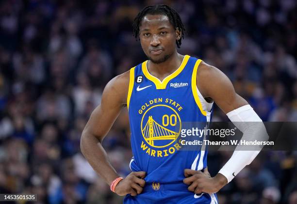 Jonathan Kuminga of the Golden State Warriors looks on against the Portland Trail Blazers during the first quarter of an NBA basketball game at Chase...