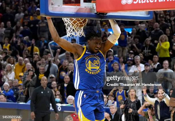 Jonathan Kuminga of the Golden State Warriors slam dunk against the Portland Trail Blazers during the fourth quarter at Chase Center on December 30,...