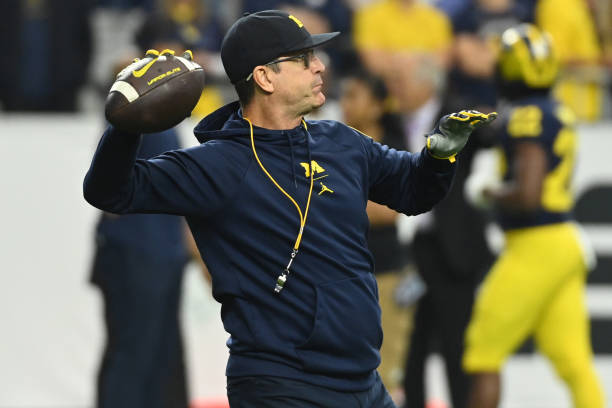 Head coach Jim Harbaugh of the Michigan Wolverines is seen during warmups prior to the game against the TCU Horned Frogs in the Vrbo Fiesta Bowl at...