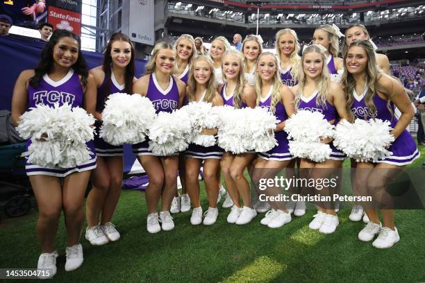 The TCU Horned Frogs cheerleaders are seen on the field prior to the game against the Michigan Wolverines in the Vrbo Fiesta Bowl at State Farm...