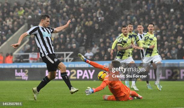 Leeds goalkeeper Illan Meslier makes a point blank save from Newcastle striker Chris Wood during the Premier League match between Newcastle United...