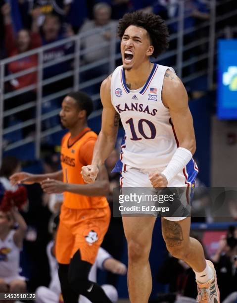 Jalen Wilson of the Kansas Jayhawks celebrates a basket against the Oklahoma State Cowboys in the second half at Allen Fieldhouse on December 31,...