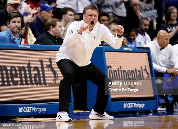 Head coach Bill Self of the Kansas Jayhawks cheers on his team against the Oklahoma State Cowboys in the first half at Allen Fieldhouse on December...