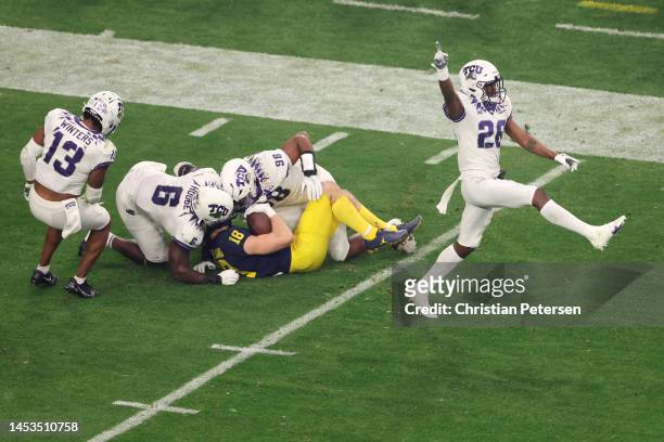 Bud Clark of the TCU Horned Frogs celebrates after stopping the Michigan Wolverines on fourth down during the first quarter in the Vrbo Fiesta Bowl...