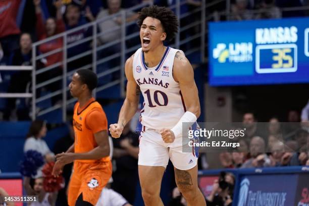 Jalen Wilson of the Kansas Jayhawks celebrates a basket against the Oklahoma State Cowboys in the second half at Allen Fieldhouse on December 31,...