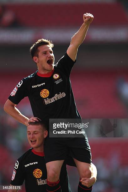 Lee Bell is caried by Adam Bungle of Crewe Alexandra after winning the npower League two play-off final between Cheltenham Town and Crewe Alexandra...