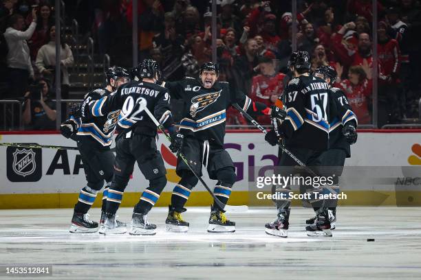 Erik Gustafsson of the Washington Capitals celebrates with Alex Ovechkin, Evgeny Kuznetsov, Trevor van Riemsdyk, and Conor Sheary after scoring a...