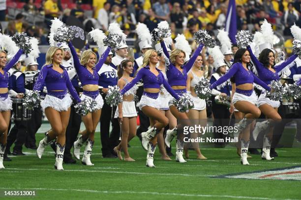The TCU Horned Frogs cheerleaders perform prior to the game against the Michigan Wolverines in the Vrbo Fiesta Bowl at State Farm Stadium on December...