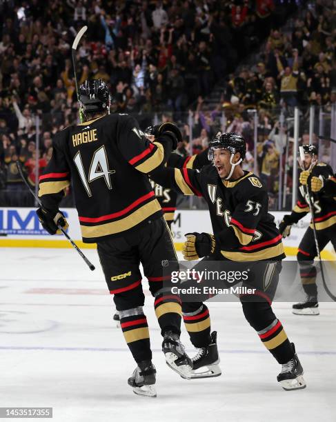 Keegan Kolesar of the Vegas Golden Knights congratulates teammate Nicolas Hague after he scored in overtime to win their game against the Nashville...