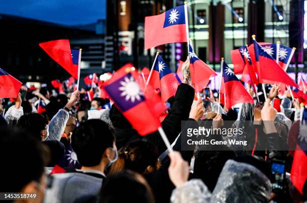 People are seen waving the flag of Taiwan in front of the Presidential Office Building of Taiwan on January 01, 2023 in Taipei, Taiwan.