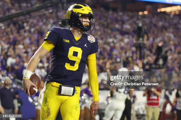 McCarthy of the Michigan Wolverines reacts after rushing for a touchdown during the third quarter against the TCU Horned Frogs in the Vrbo Fiesta...