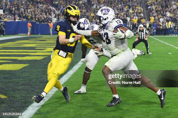 Dee Winters of the TCU Horned Frogs returns an interception for a touchdown during the third quarter against the Michigan Wolverines in the Vrbo...