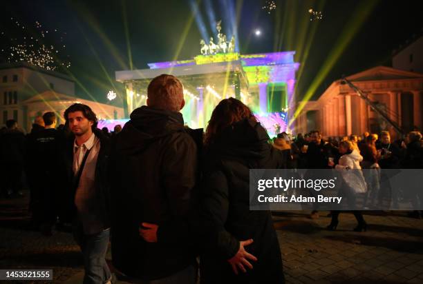 Visitors celebrate the new year at the Brandenburg Gate on January 01, 2023 in Berlin, Germany. For the past two years amidst the Coronavirus...