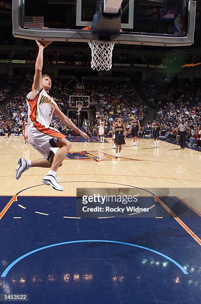 Bob Sura of the Golden State Warriors lays up the ball during a fast break against the Denver Nuggets at The Arena in Oakland, California. DIGITAL...