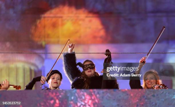 String musicians perform at the Brandenburg Gate on December 31, 2023 in Berlin, Germany. For the past two years amidst the Coronavirus pandemic,...