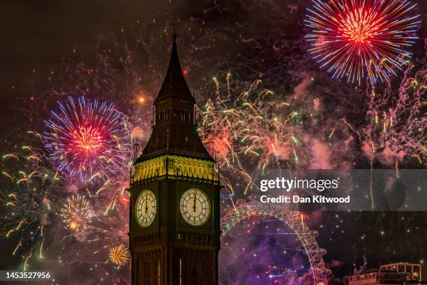 Fireworks light up the London skyline over Big Ben and the London Eye just after midnight on January 1, 2023 in London, England. London's New Years'...