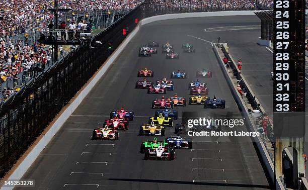 Ryan Brisco2, driver of the IZOD Team Penske Chevrolet, leads the field at the start of the IZOD IndyCar Series 96th running of the Indianapolis 500...