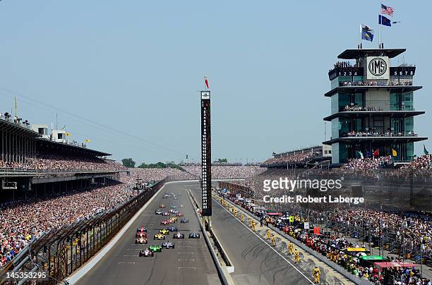 Ryan Briscoe, driver of the IZOD Team Penske Chevrolet, leads the field at the start of the IZOD IndyCar Series 96th running of the Indianapolis 500...