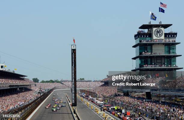 Ryan Briscoe, driver of the IZOD Team Penske Chevrolet, leads the field at the start of the IZOD IndyCar Series 96th running of the Indianapolis 500...