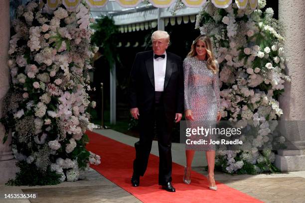 Former U.S. President Donald Trump and former first lady Melania Trump arrive for a New Years event at his Mar-a-Lago home on December 31, 2022 in...