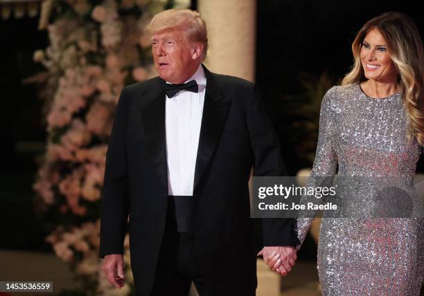 Former U.S. President Donald Trump and former first lady Melania Trump arrive for a New Years event at his Mar-a-Lago home on December 31, 2022 in...