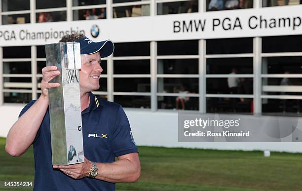 Luke Donald of England holds the trophy following his victory during the final round of the BMW PGA Championship on the West Course at Wentworth on...