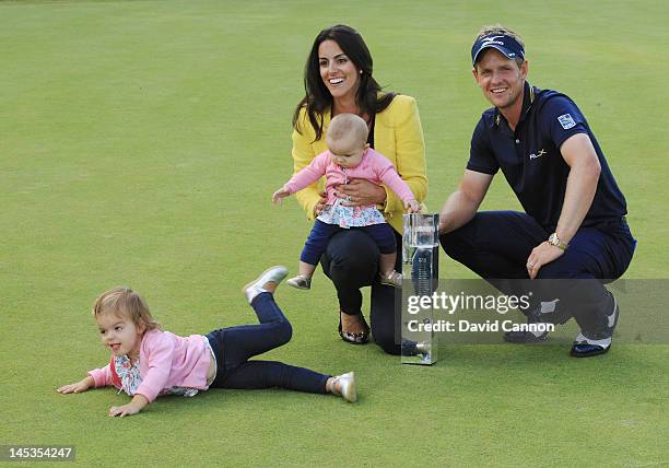 Luke Donald of England poses with the trophy with wife Diane and daughters Elle and Sophia Ann during the final round of the BMW PGA Championship on...