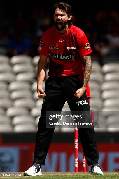 Kane Richardson of the Renegades celebrates the wicket of Faf Du Plesssis of the Scorchers during the Men's Big Bash League match between the...