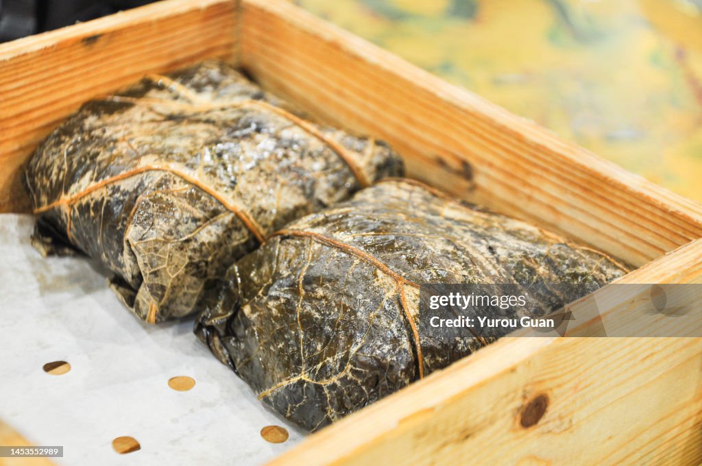 Traditional Chinese food: Delicious Lo Mai Gai (zongzi) dim sum, fresh steamed glutinous rice with chicken roll wrapped by lotus leaf in bamboo steamer in Jiangmen¡¯s restaurant, South China¡¯s Guangdong Province.