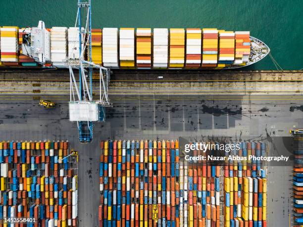 aerial view cargo ship terminal. - cargo container port stock pictures, royalty-free photos & images