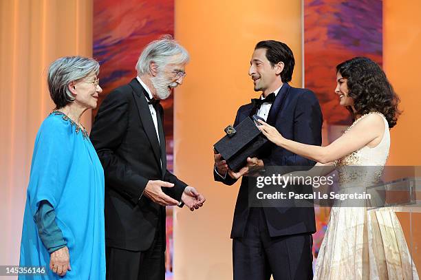 Actress Emmanuelle Riva looks on as director Michael Haneke receives the Palme D’Or for "Amour" from actors Adrien Brody and Audrey Tautou onstage at...