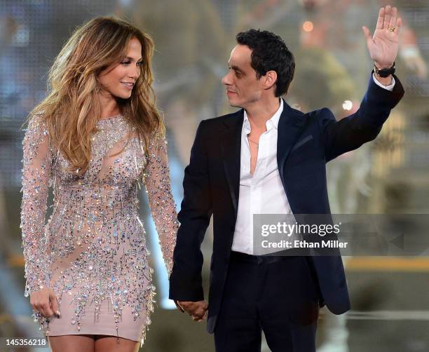 Singer/actress Jennifer Lopez and singer Marc Anthony appear during the finale of the Q'Viva! The Chosen Live show at the Mandalay Bay Events Center...