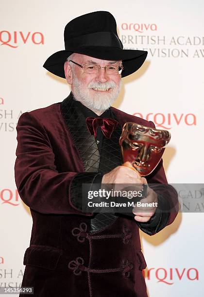 Winner of Best Single Documentary Terry Pratchett poses in front of the winners boards at the Arqiva British Academy Television Awards 2012 held at...