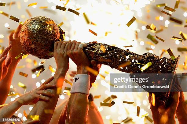 Kiel players lift the trophy after the EHF Final Four final match between THW Kiel and BM Atletico Madrid at Lanxess Arena on May 27, 2012 in...