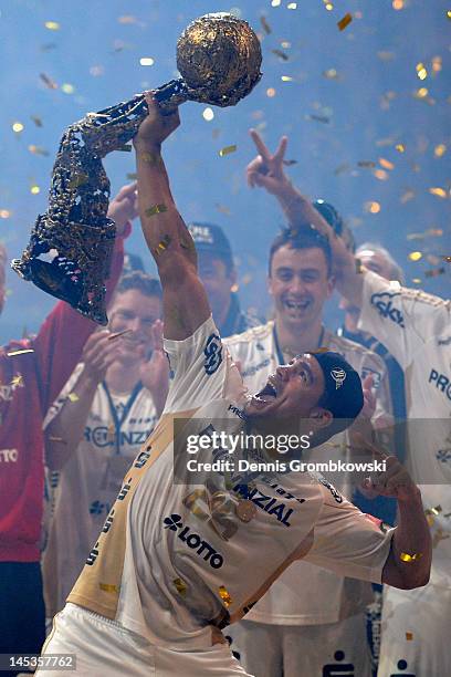 Daniel Narcisse of Kiel lifts the trophy after the EHF Final Four final match between THW Kiel and BM Atletico Madrid at Lanxess Arena on May 27,...