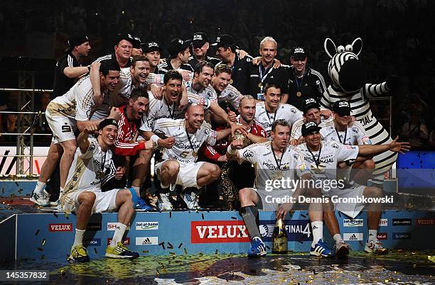 Kiel players celebrate after the EHF Final Four final match between THW Kiel and BM Atletico Madrid at Lanxess Arena on May 27, 2012 in Cologne,...