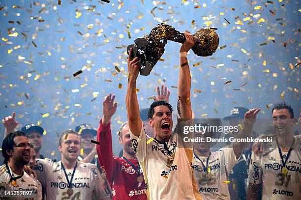 Kim Andersson of Kiel lifts the trophy after the EHF Final Four final match between THW Kiel and BM Atletico Madrid at Lanxess Arena on May 27, 2012...