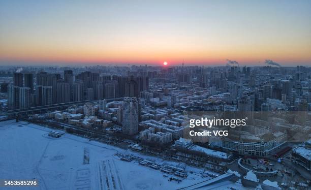 Sun rises over buildings on New Year's Day on January 1, 2023 in Harbin, Heilongjiang Province of China.