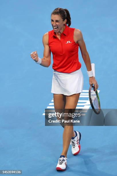 Petra Martic of Croatia celebrates winning a game in the third set of the Women's singles match against Nadia Podoroska of Argentina during day four...