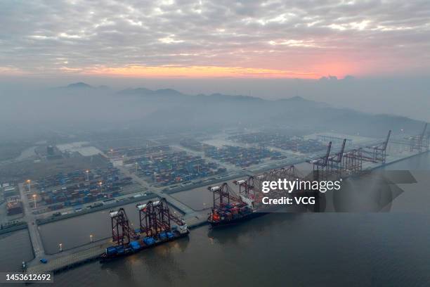 Aerial view of container ship Zenith Lumos sitting parked at Dapukou Container Terminal of Ningbo-Zhoushan Port at night on January 1, 2023 in...