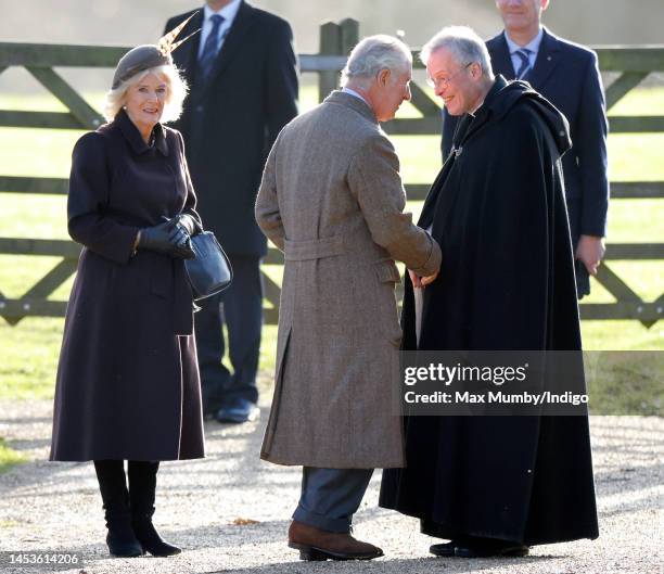 Camilla, Queen Consort and King Charles III are greeted by The Reverend Canon Dr Paul Williams as they attend the New Year's Day service at the...