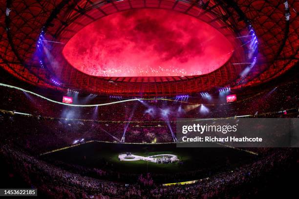Fireworks go off as Lionel Messi of Argentina lifts the FIFA World Cup Trophy after the team's victory during the FIFA World Cup Qatar 2022 Final...