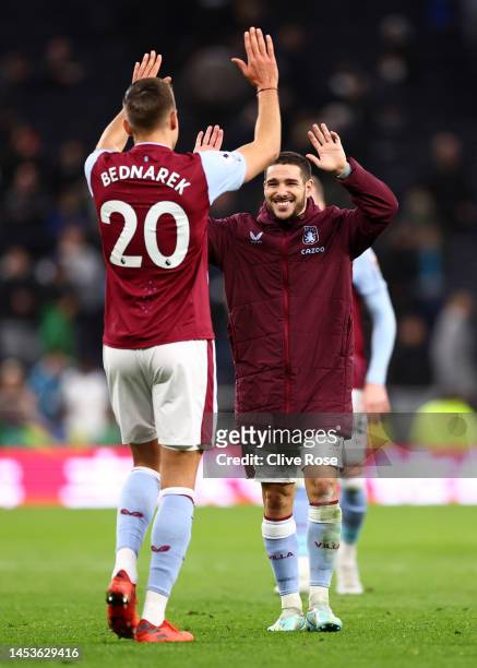 Jan Bednarek and Emi Buendia of Aston Villa celebrate following their sides victory after the Premier League match between Tottenham Hotspur and...