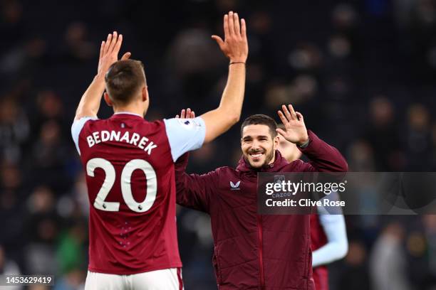 Jan Bednarek and Emi Buendia of Aston Villa celebrate following their sides victory after the Premier League match between Tottenham Hotspur and...