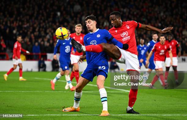 Kai Havertz of Chelsea is challenged by Willy Boly of Nottingham Forest during the Premier League match between Nottingham Forest and Chelsea FC at...