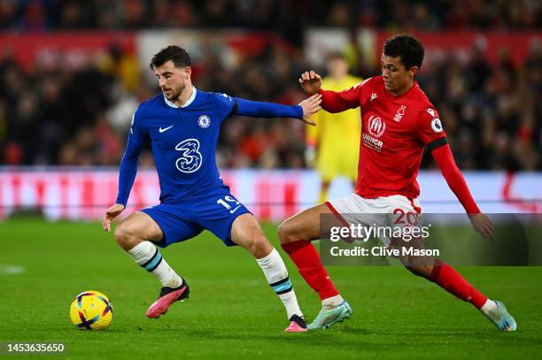 Mason Mount of Chelsea holds off Brennan Johnson of Nottingham Forest during the Premier League match between Nottingham Forest and Chelsea FC at...