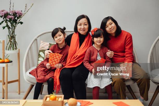 cheerful asian family portrait for chinese new year - fashionable grandma stock pictures, royalty-free photos & images