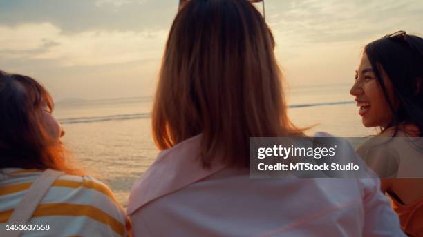 close up group of young asian women celebrating and drinking alcohol on tropical beach. - asian female friends drinking soda outdoor stock pictures, royalty-free photos & images