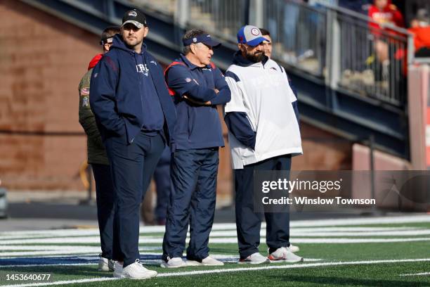Joe Judge, head coach Bill Belichick and Mat Patricia of the New England Patriots look on before a game against the Miami Dolphins at Gillette...